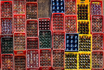 multicolored plastic crates, plastic crate lot, beverage crates, soda bottles, organized crates, storage crates, colorful crates, stacked crates, drink storage, industrial crates, beverage storage