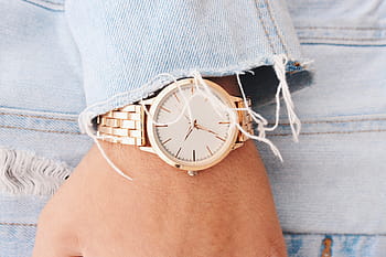round silver-colored analog, watch, 6:45, hand, wrist, gold, time, denim, clothing