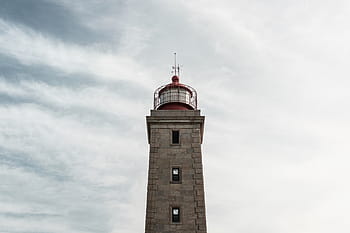 low, angle photography, concrete, tower, architecture, building, infrastructure, clouds, sky, landmark, lighthouse