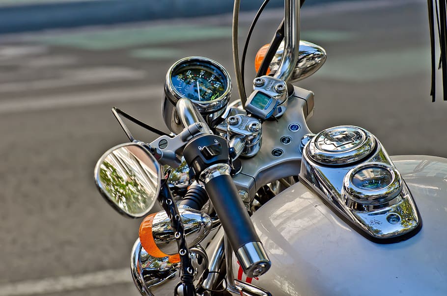 selective-focus photography, white, Motorcycle, Rear-View Mirror, Handlebar, bike deposit, street, transportation, high angle view, day, close-up