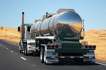 Highway 5, truck on road, semi-truck, tanker truck, road transport, highway transportation, trucking industry, long-haul truck, commercial vehicle, road safety, landscape background