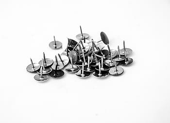 button, thumbtacks, spikes, an injection