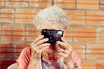 woman, using, black, kodak film camera, orange, people, camera, photography, photographer, old, grandma