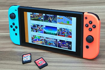 přepínač nintendo, otočil, hnědý, povrch, dva, herní kazety, nintendo, utěšit, hra, video, hrát si