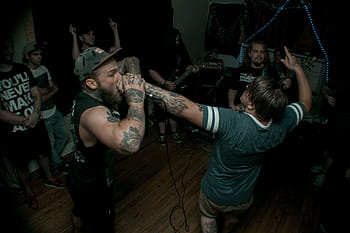 fan, screaming, band vocalist microphone, hand, inside, room, people, man, tattoo, art, party