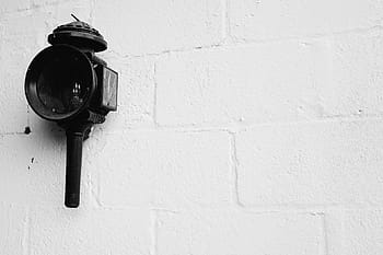 black lens, black, sconce, lantern, wall, concrete, black and white, indoors, close-up, white background, day