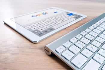 white, ipad, showing, google, pro, near, magic, keyboard, brown, wooden, table