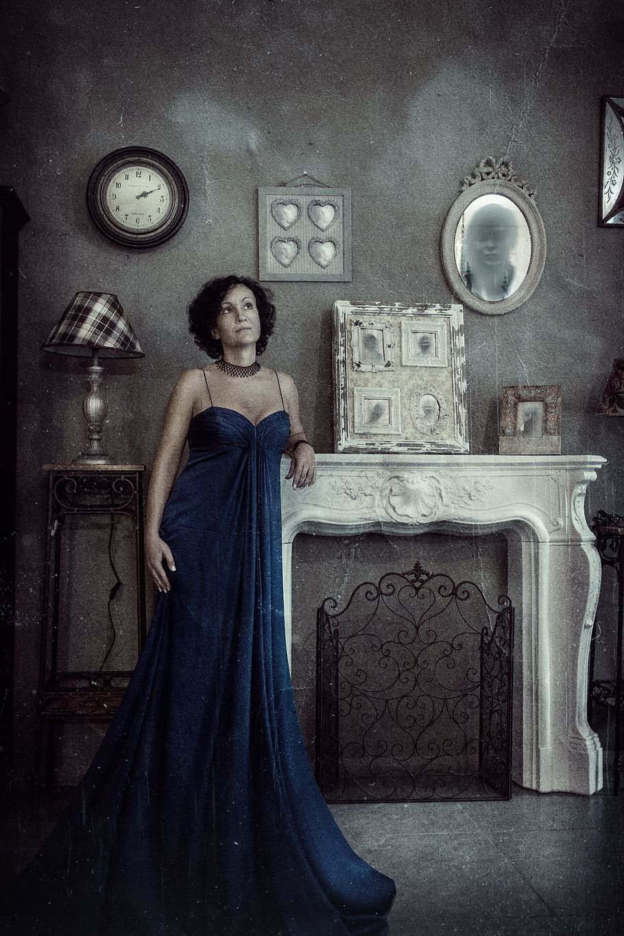 woman, blue, dress, leaning, white, concrete, fireplace mantel, staring, woman in blue, blue dress, portrait