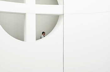 man, standing, window, daytime, white, suit, view, small, hole, wall, door