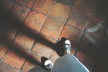 person, wearing, pair, sneakers, black, white, low, top, shorts, standing, brown