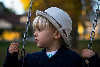 people, kid, boy, child, swing, chain, hat, playground