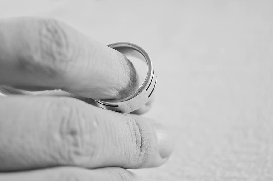 person, holding, silver-colored ring, hand, finger, people, ring, marriage, divorce, decisions, background