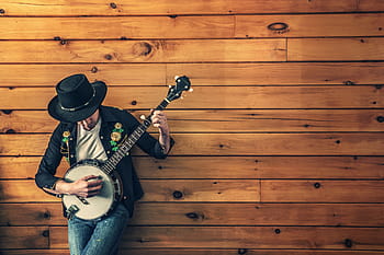 man, black, quarter-sleeved shirt, blue, jeans, holding, banjo, musician, country song, ukulele, guitar