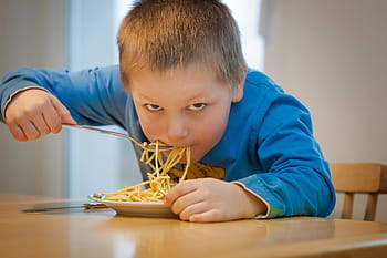 boy, blue, sweatshirt, eating, pasta, brown, wooden, table, daytime, eat, noodles