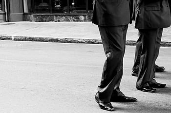 men, suites, pants, dress shoes, street, sidewalk, pavement, black and white