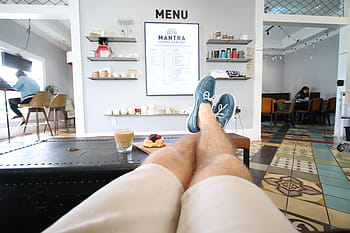 person, feet, black, wooden, table, restaurant, menu, footwear, shoes, coffee, desert