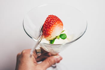 person, holding, drinking glass, strawberry pastry, strawberry, food, crops, fruits, red, juice, glass