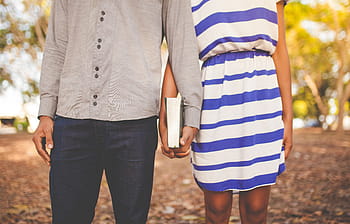 man, woman, holding, hands, together, daytime, people, couple, holding hands, book, male