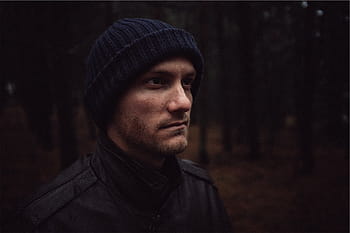 low, light photography, man, wearing, black, knit, cap, jacket, facing, right, guy