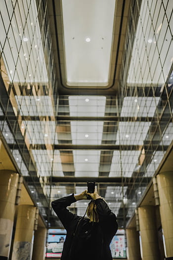 man, using, camera, taking, building, architecture, infrastructure, indoor, glass, reflection, people