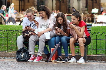 four, woman, sitting, bench, girls, cell phones, distracted, cell phone, cell, phone, young