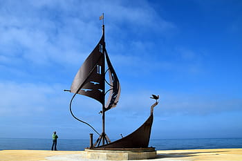 person, standing, sailboat statue, ship, boot, water, sea, sailing boat, monument, fishermen's monument, horizon