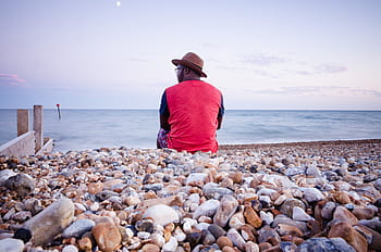 man, sitting, beach pebbles, men, s, wearing, red, black, long, sleeve, shirt