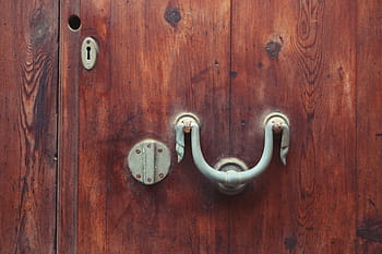 white, metal door knocker, wooden, brown, surface, gray, metal, knocker, wood, door, handle