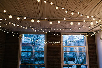 turned-on string lights, window, interior, design, ceiling, lights, bulb, electricity, bricks, wall, indoor