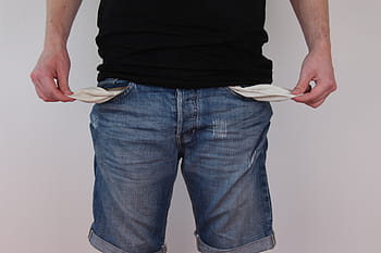 person, wearing, blue, denim shorts, showing, empty, pockets, trouser pockets, jeans, no money, poverty