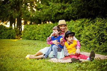 woman, hugging, two, kids, picnic mat, park, mom and sons, family, stroll, mom, child