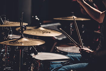 person playing drums, person, wearing, black, shirt, playing, drum, drums, set, people, man