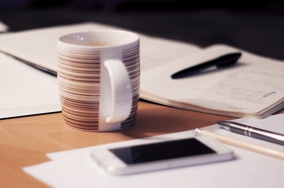 brown, white, ceramic, cup, table, iPhone, business, working, office, desk, notebooks