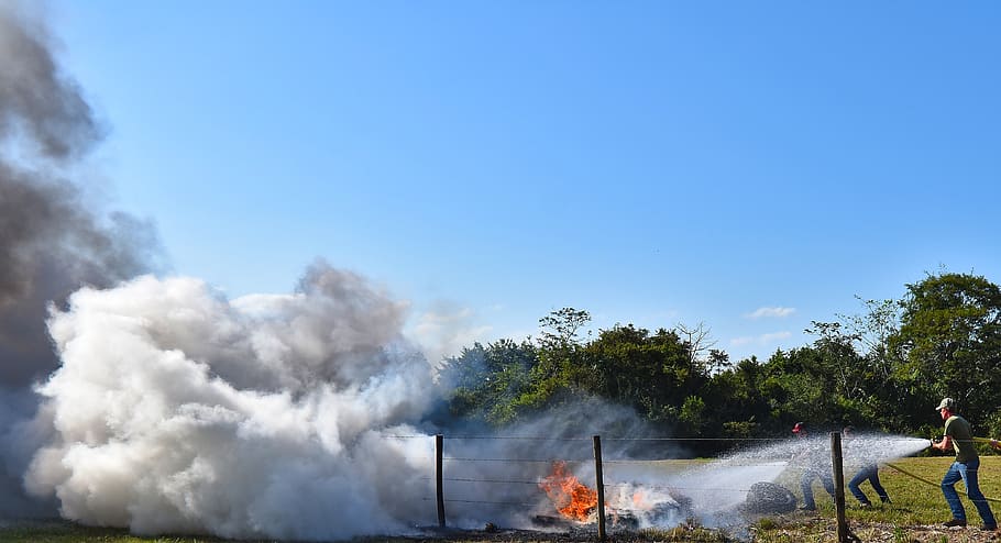fire, fire fighter, emergency, tires, water, spray, douse, fence, rural, water nature, outdoors