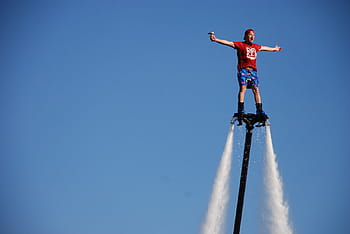 person, riding, black, hydro jet, water, show, fly, airborn, raves, pride, waterski