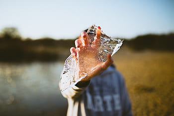 person, holding, broken, glass, people, man, hand, ice, nature, grass, river