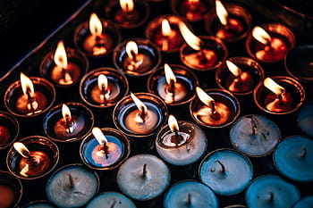tealight candles, lit, candle, light, fire, flame, night, large group of objects, indoors, backgrounds, close-up
