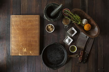 chopping, cast iron, butcher knife, brown, black, ceramic, containers, wooden, table, wood, cuttingboard