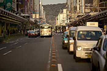cars, busses, trucks, road, street, traffic, busy, city, buildings, stores, shops