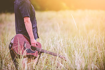 person, holding, guitar, grass field, grass, field, men, outdoors, nature, one Person, people