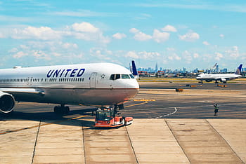 white, united, airplane, runway, travel, adventure, plane, vacation, trip, transportation, vehicle