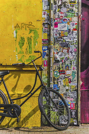 black, cruiser bicycle, parked, door, bicycle, bike, aesthetic, stickers, vandalism, paper, sign