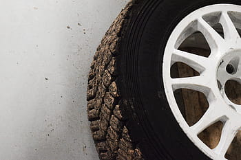 white, multi-spoke vehicle wheel, tire, floor, car, tires, wheel, rubber, tyre, black, service