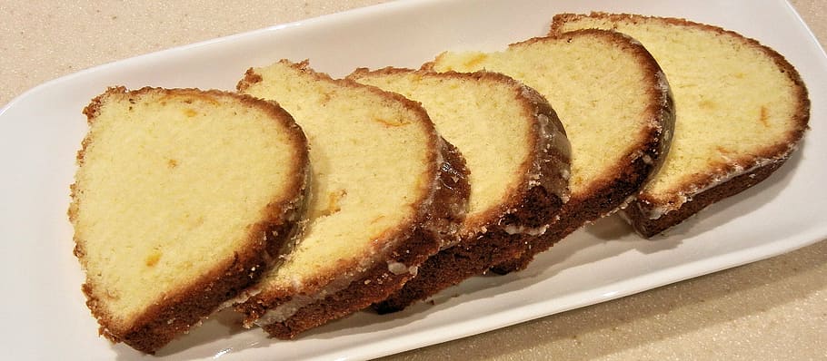 スライスしたオレンジケーキ、 粉砂糖、 食品
