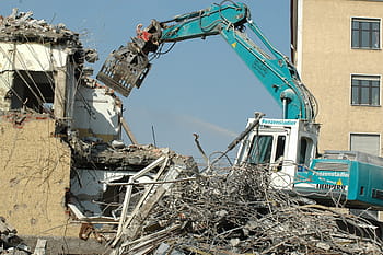 teal, white, heavy, duty equipment, daytime, crash, site, crane, water, construction workers, gutting