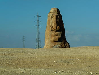 Marrone, statua, grigio, post elettricità di metallo, giorno, calcestruzzo, capo, accanto, elettrico, inviare, pietra scolpita