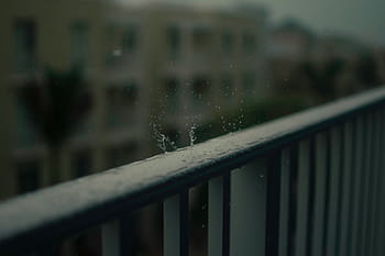 selective, focus photo, water droplets, metal rails, guardrail, fence, blur, dark, outdoor