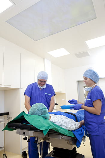 man, woman, wearing, blue, scrub, top, pants, operation, doctor, surgeon, hospital