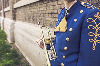 man wearing trumpet, man, trumpet, people, object, lazy, band, talented, performer, musician, vintage