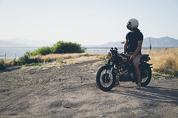 person, sitting, black, motorcycle, man, crew, neck, shirt, riding, cruiser, near